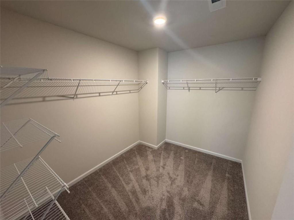 3376 Highbury Way Stonecrest, GA 30038 - Photo 13 of 28 a view of a room with racks on the wall