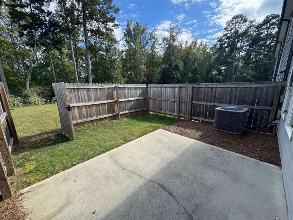 3376 Highbury Way Stonecrest, GA 30038 - Photo 25 of 28 a view of a backyard with a small cabin
