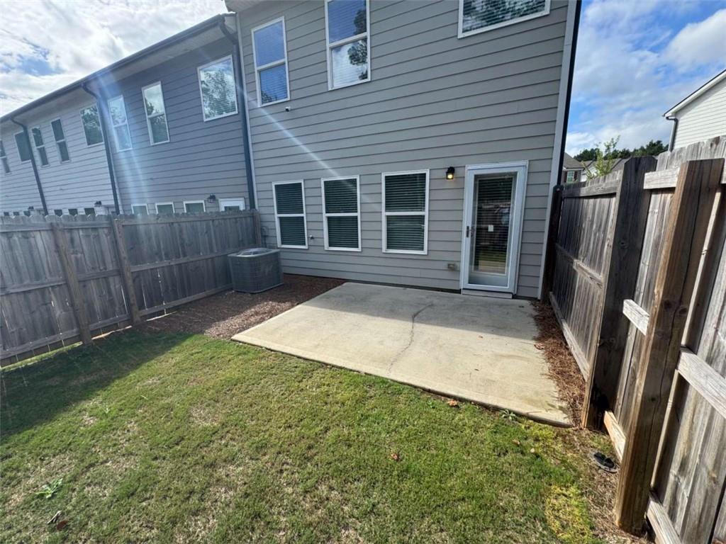 3376 Highbury Way Stonecrest, GA 30038 - Photo 26 of 28 a front view of a house with garden
