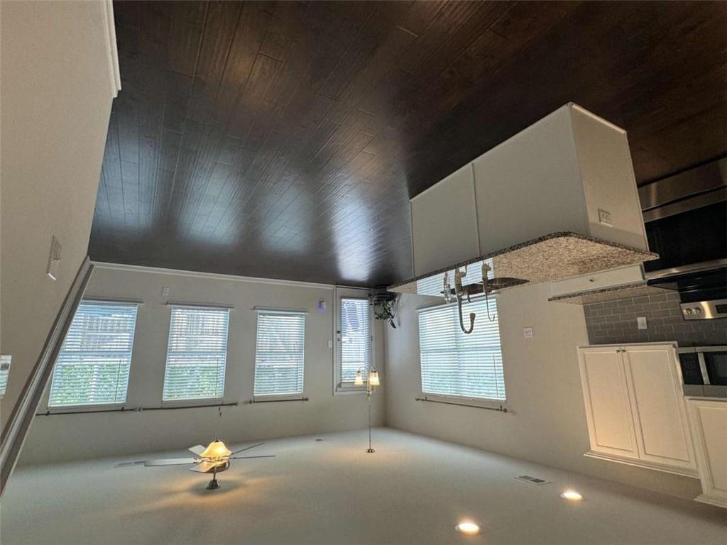 3376 Highbury Way Stonecrest, GA 30038 - Photo 4 of 28 an open kitchen with wooden floor and large window