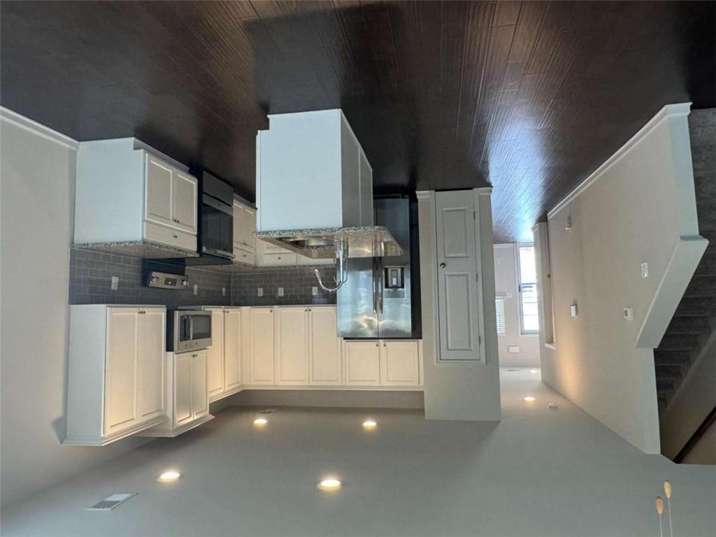 3376 Highbury Way Stonecrest, GA 30038 - Photo 5 of 28 a kitchen with stainless steel appliances a refrigerator a stove top oven and a sink