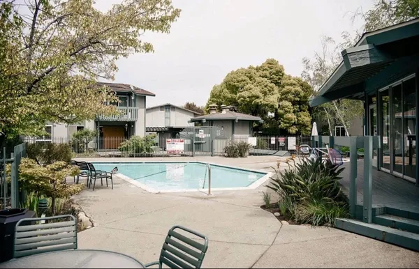 a view of a swimming pool with a patio