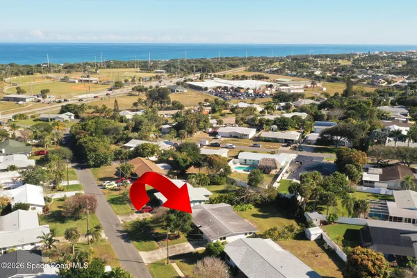 an aerial view of residential building with parking space