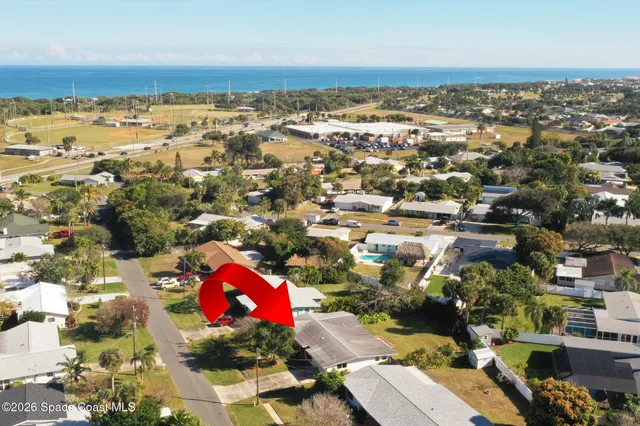 an aerial view of residential building with parking space