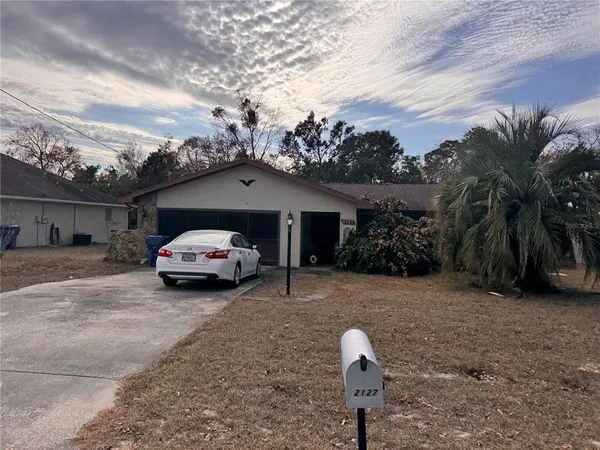 a car parked in front of a house