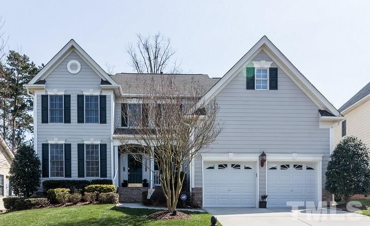 9124 Palm Bay Circle Raleigh, NC 27617 - Photo 1 of 24 a front view of a house with garden