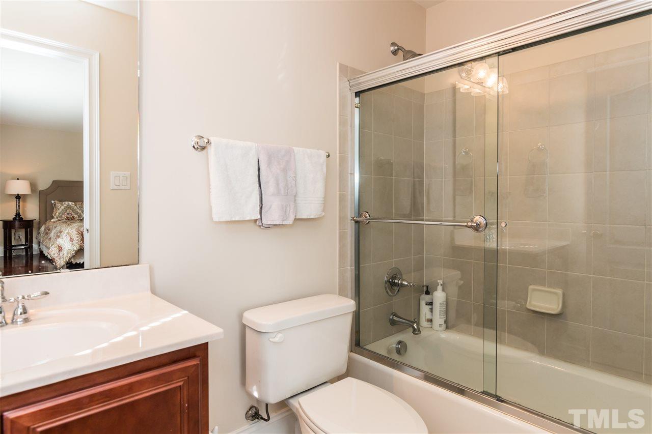 9124 Palm Bay Circle Raleigh, NC 27617 - Photo 14 of 24 a bathroom with a sink a toilet and shower