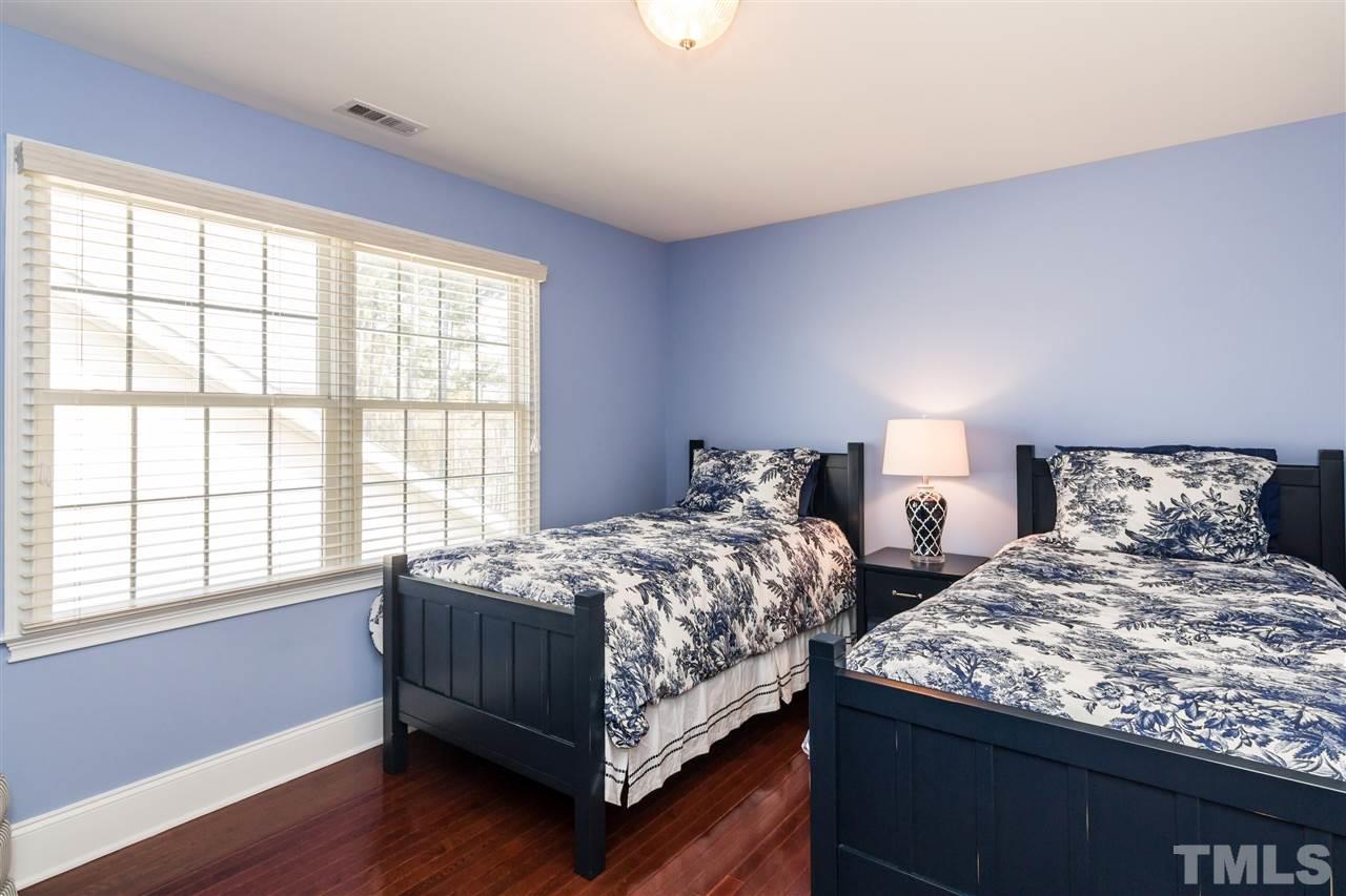 9124 Palm Bay Circle Raleigh, NC 27617 - Photo 17 of 24 a bedroom with two beds and a large window