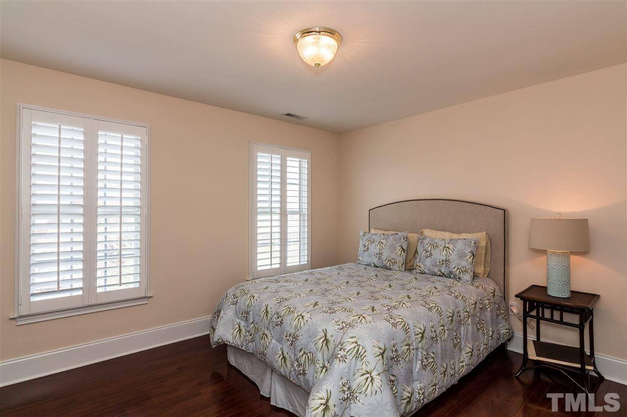 9124 Palm Bay Circle Raleigh, NC 27617 - Photo 19 of 24 a bedroom with a bed and a window