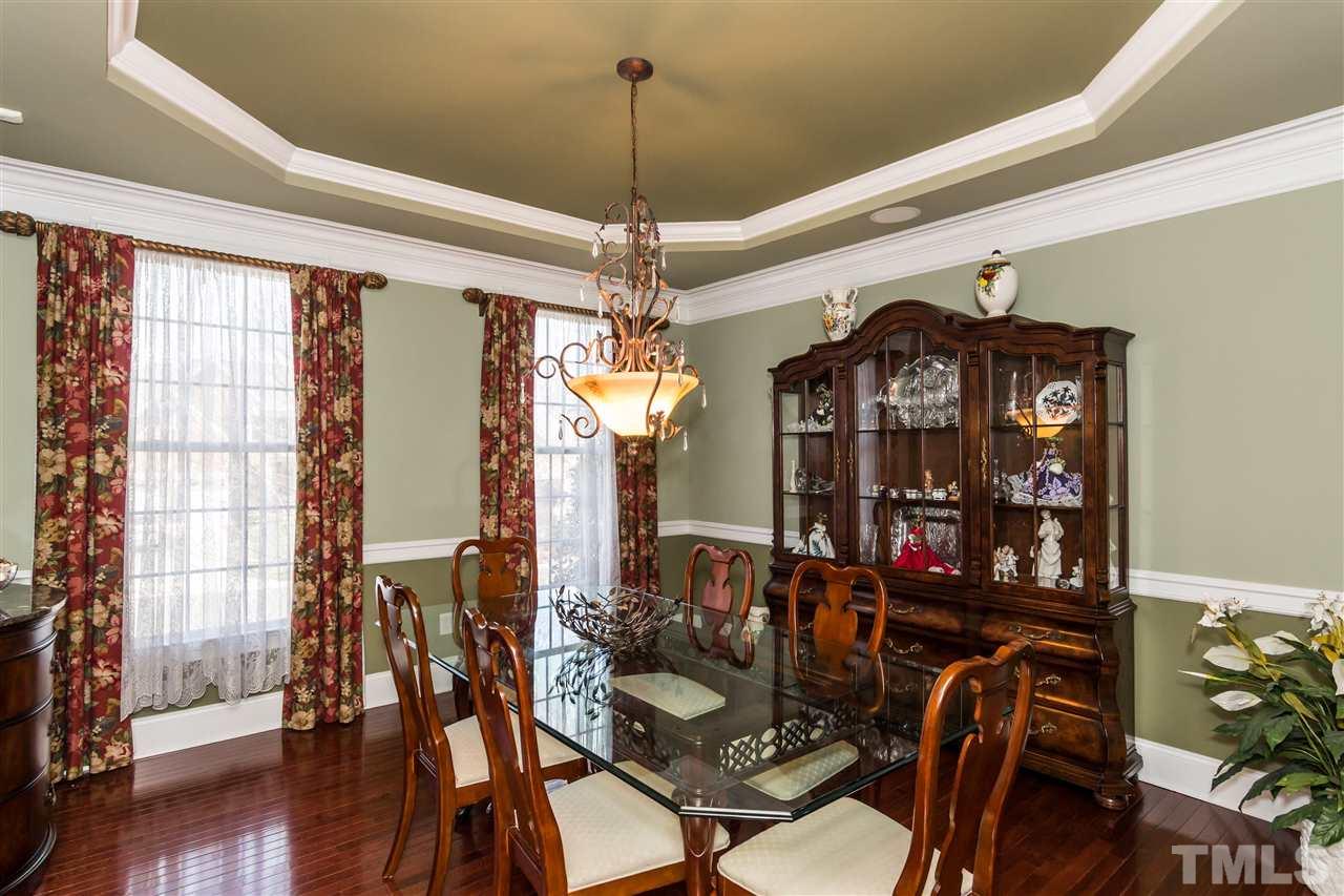 9124 Palm Bay Circle Raleigh, NC 27617 - Photo 5 of 24 a view of a dining room with furniture and wooden floor