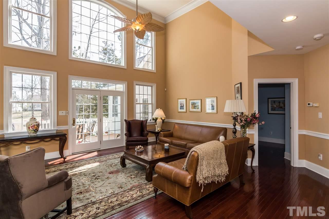 9124 Palm Bay Circle Raleigh, NC 27617 - Photo 6 of 24 a living room with furniture and a large window