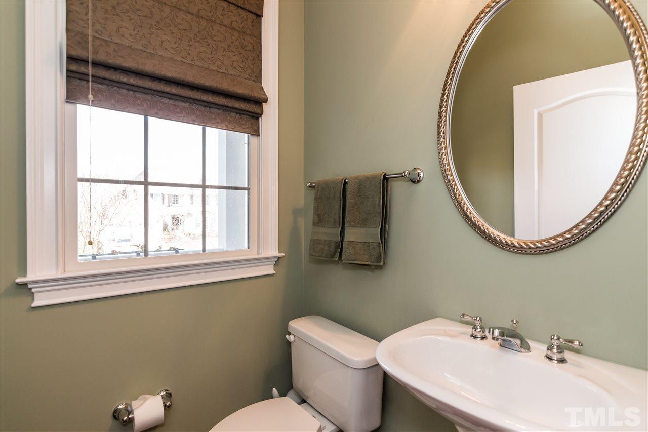 9124 Palm Bay Circle Raleigh, NC 27617 - Photo 10 of 24 a bathroom with a sink and a mirror