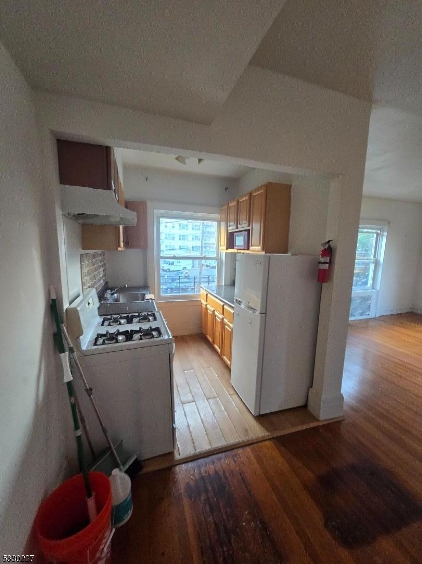 379-387 Mt Prospect Avenue, Unit 4 Newark, NJ 07104 - Photo 6 of 21 a living room with furniture and a table