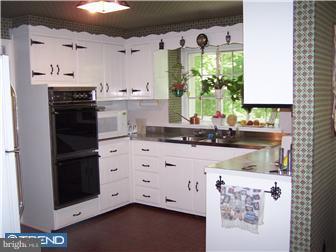 443 Righters Mill Road Narberth, PA 19072 - Photo 5 of 11 a kitchen with a stove a sink and a refrigerator