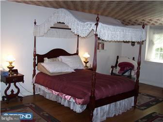 443 Righters Mill Road Narberth, PA 19072 - Photo 8 of 11 a bedroom with a bed and window