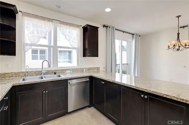 a kitchen with a sink and a window