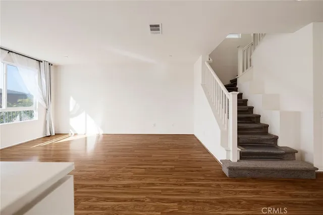 a view of an entryway with wooden floor