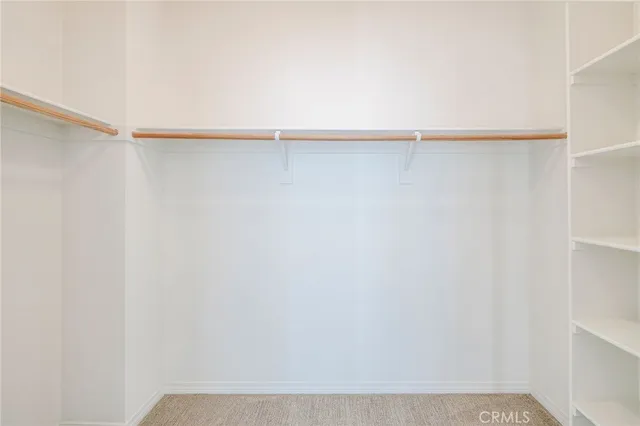 a view of a bathroom from a corridor