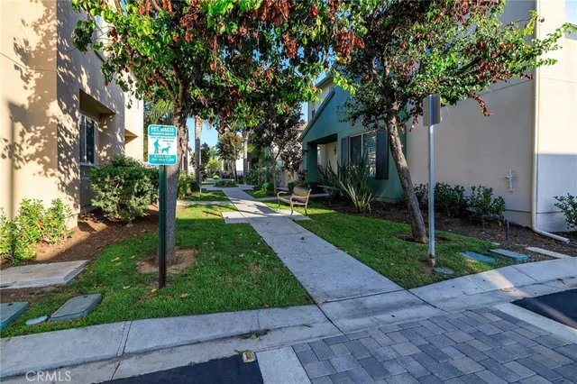 a view of a swimming pool with a patio and a yard
