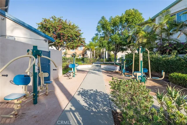 a house with lots of trees in front of it