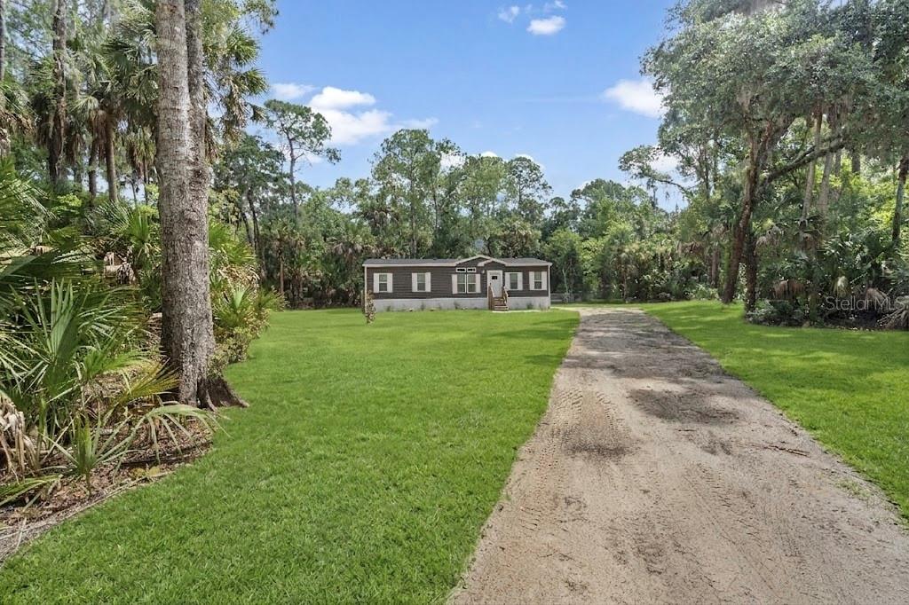375 Sapp Street Inglis, FL 34449 - Photo 35 of 36 a view of a park with a bench and trees