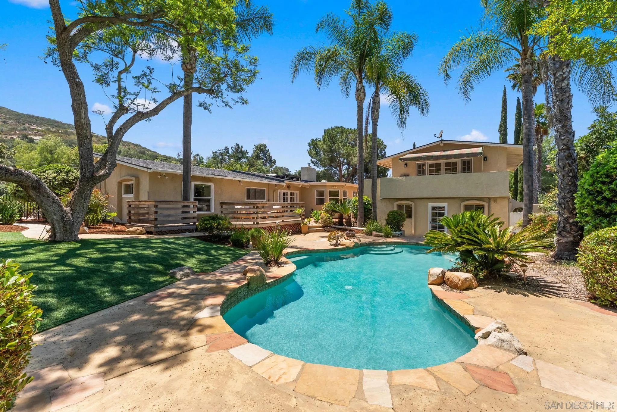 12832 Stone Canyon Road Poway, CA 92064 - Photo 43 of 60 a view of a swimming pool with a garden