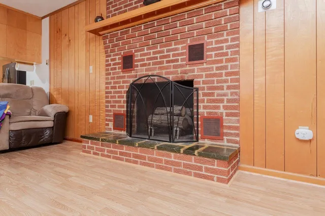 a brick building with a door and a window