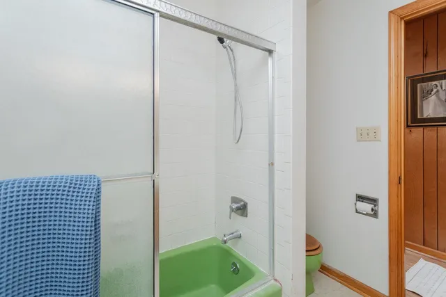 a bathroom with a shower and a sink