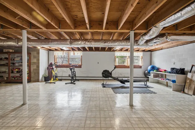 a view of a gym with wooden floor