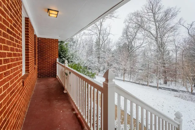 a view of a stairs and wooden floor