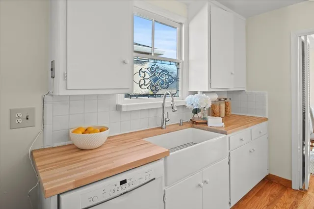 a kitchen with a sink and cabinets