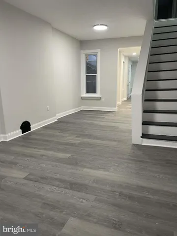 an empty room with wooden floor