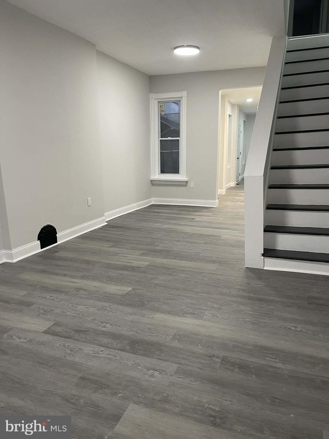 124 Pear Street Reading, PA 19601 - Photo 2 of 19 an empty room with wooden floor