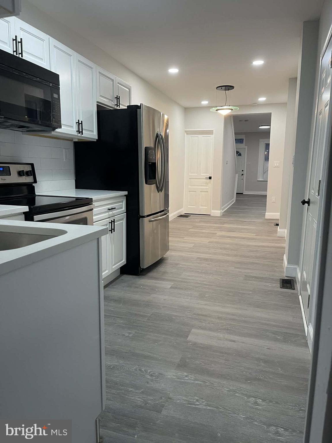 124 Pear Street Reading, PA 19601 - Photo 6 of 19 a kitchen with stainless steel appliances a refrigerator a stove top oven a sink and dishwasher