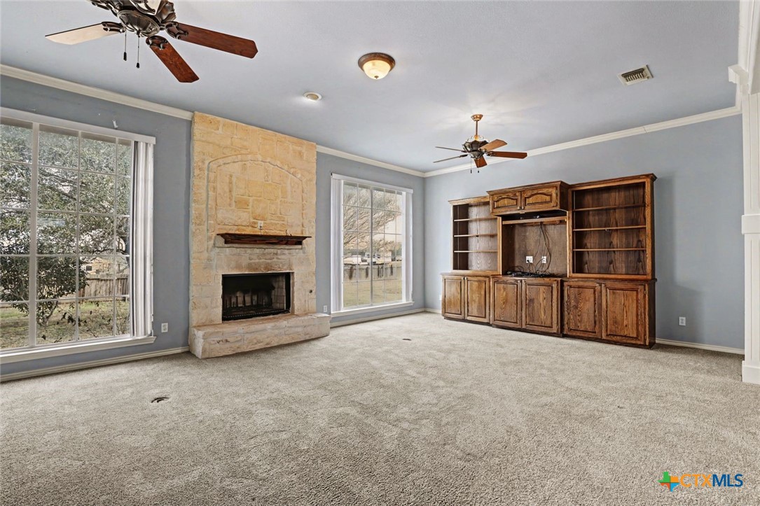 307 West Main Street Stockdale, TX 78160 - Photo 13 of 36 a view of an empty room with a fireplace and a window
