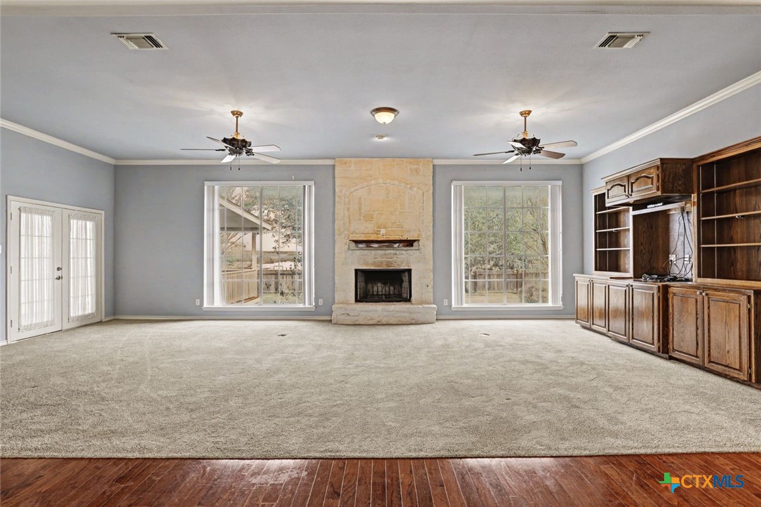 307 West Main Street Stockdale, TX 78160 - Photo 14 of 36 a view of an empty room with a window and wooden floor