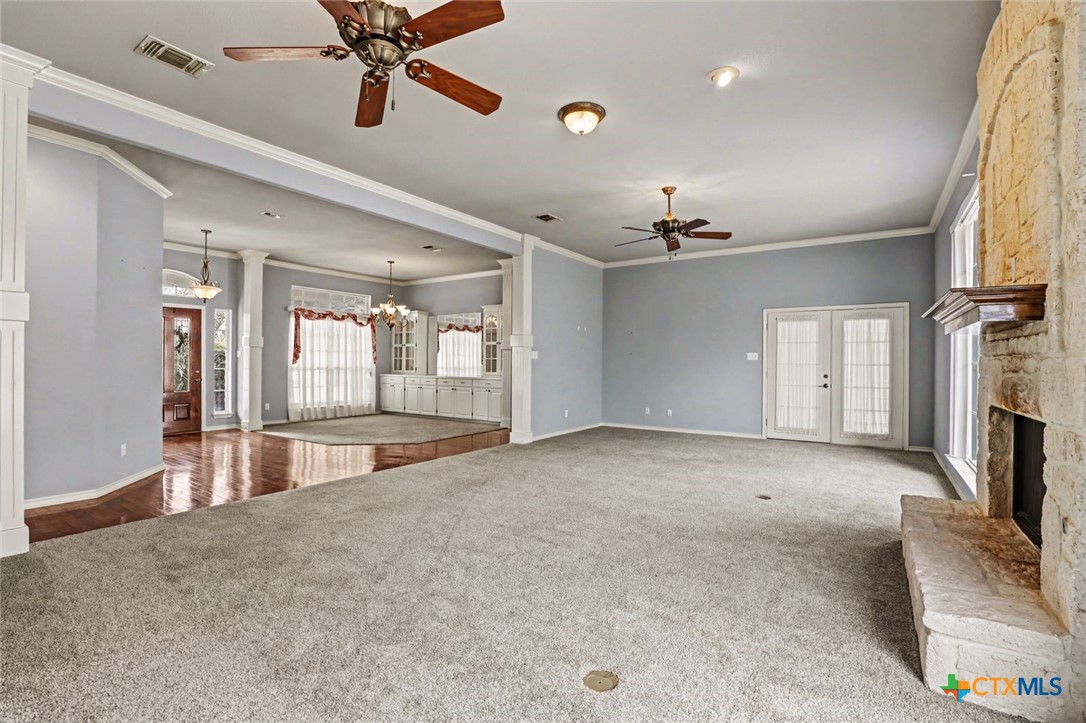 307 West Main Street Stockdale, TX 78160 - Photo 15 of 36 a view of an empty room with a fireplace and a window