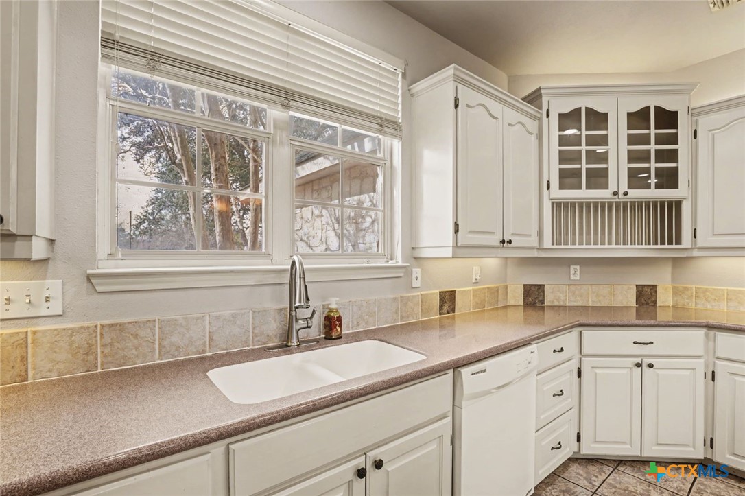 307 West Main Street Stockdale, TX 78160 - Photo 18 of 36 a bathroom with a sink and a window