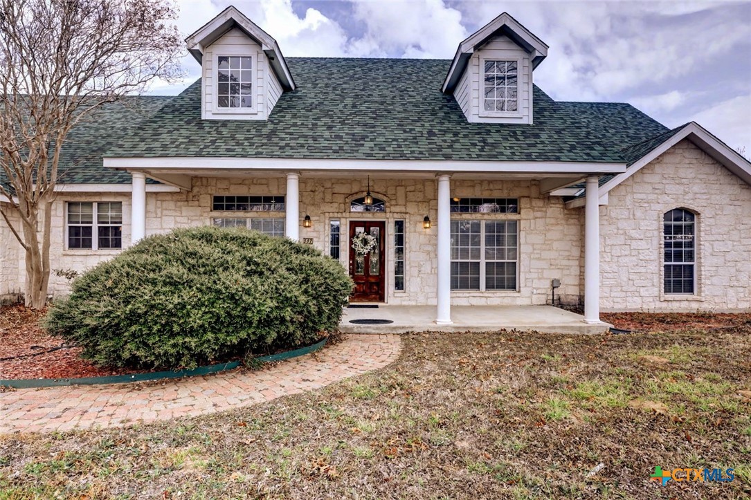 307 West Main Street Stockdale, TX 78160 - Photo 2 of 36 front view of a house with a garden