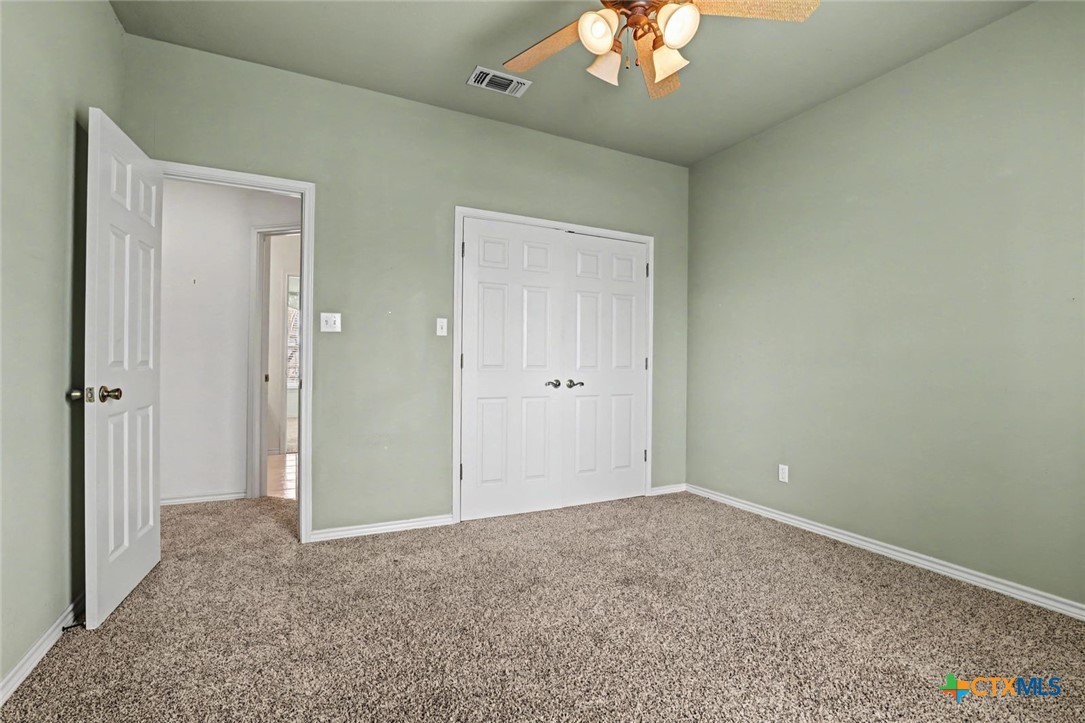 307 West Main Street Stockdale, TX 78160 - Photo 29 of 36 a view of an empty room with a chandelier fan