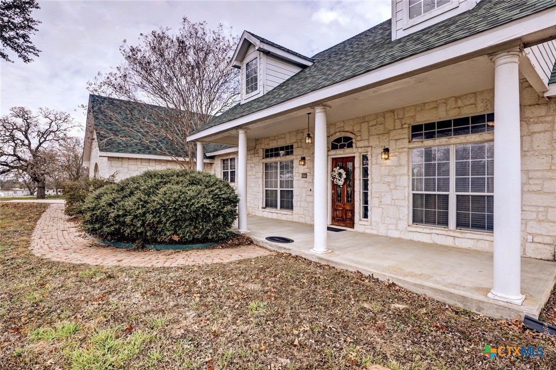 307 West Main Street Stockdale, TX 78160 - Photo 3 of 36 a view of a house with a large window and plants