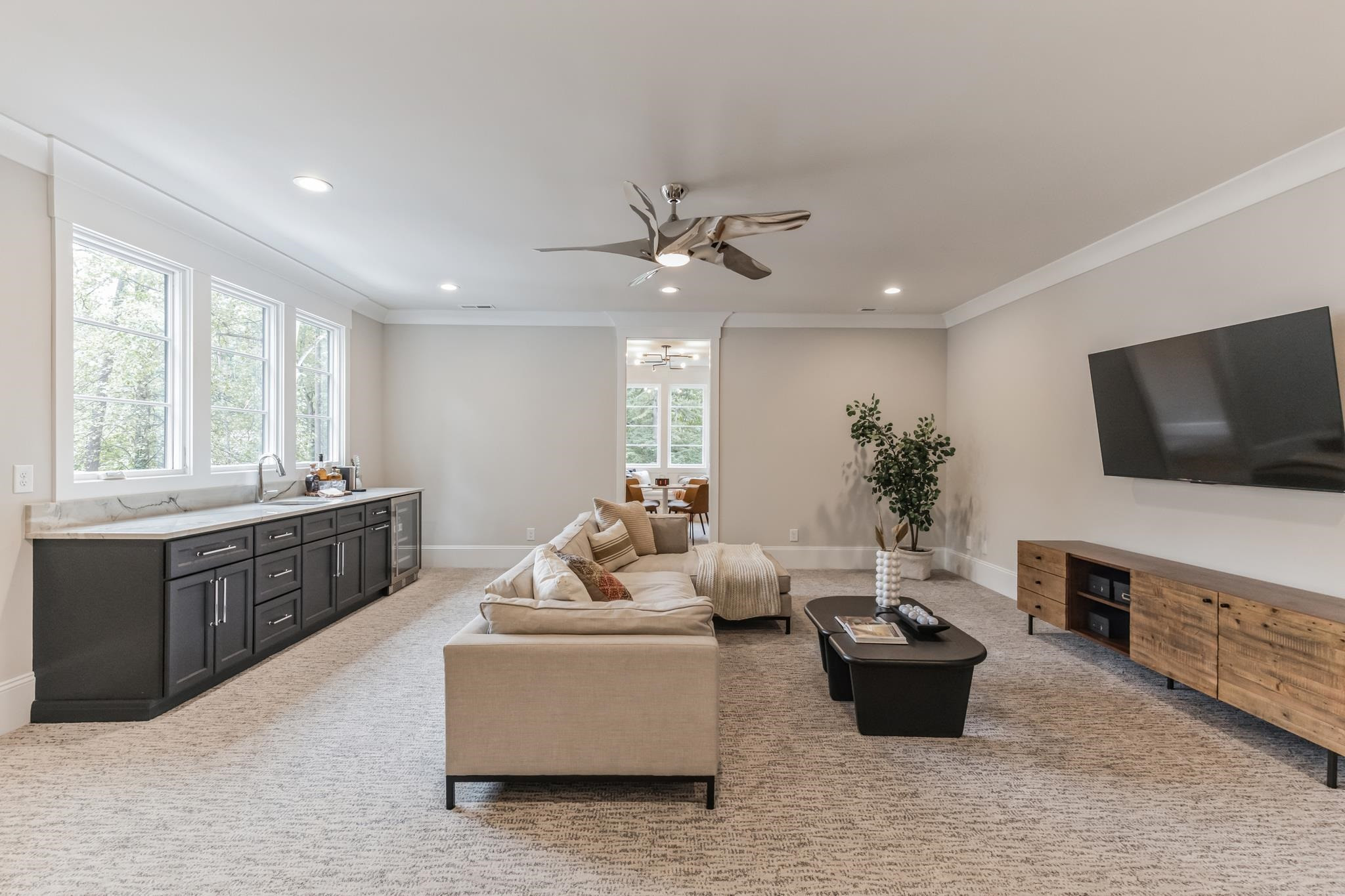 7317 Grist Mill Road Raleigh, NC 27615 - Photo 74 of 89 a living room with furniture and a flat screen tv