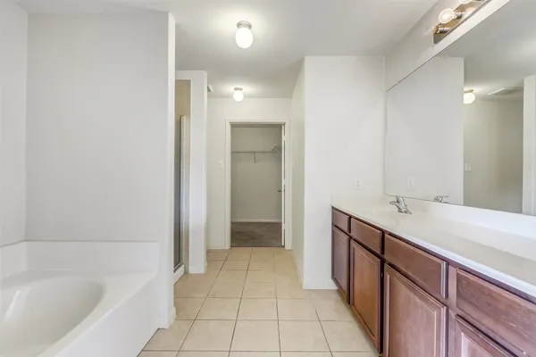 a bathroom with a sink a vanity and a mirror