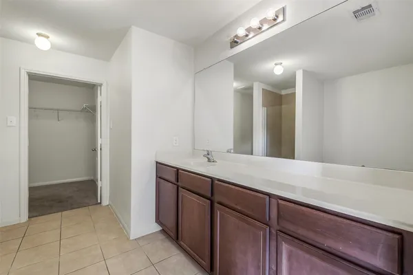 a white bath tub sitting next to a shower