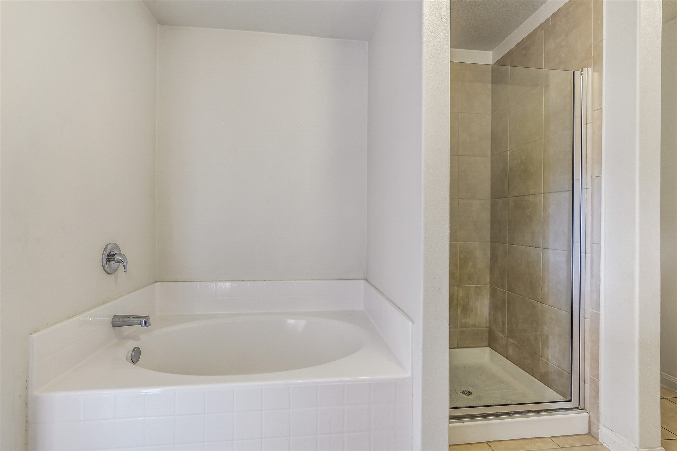 22719 Tabberts Way Hockley, TX 77447 - Photo 18 of 28 a white bath tub sitting next to a shower