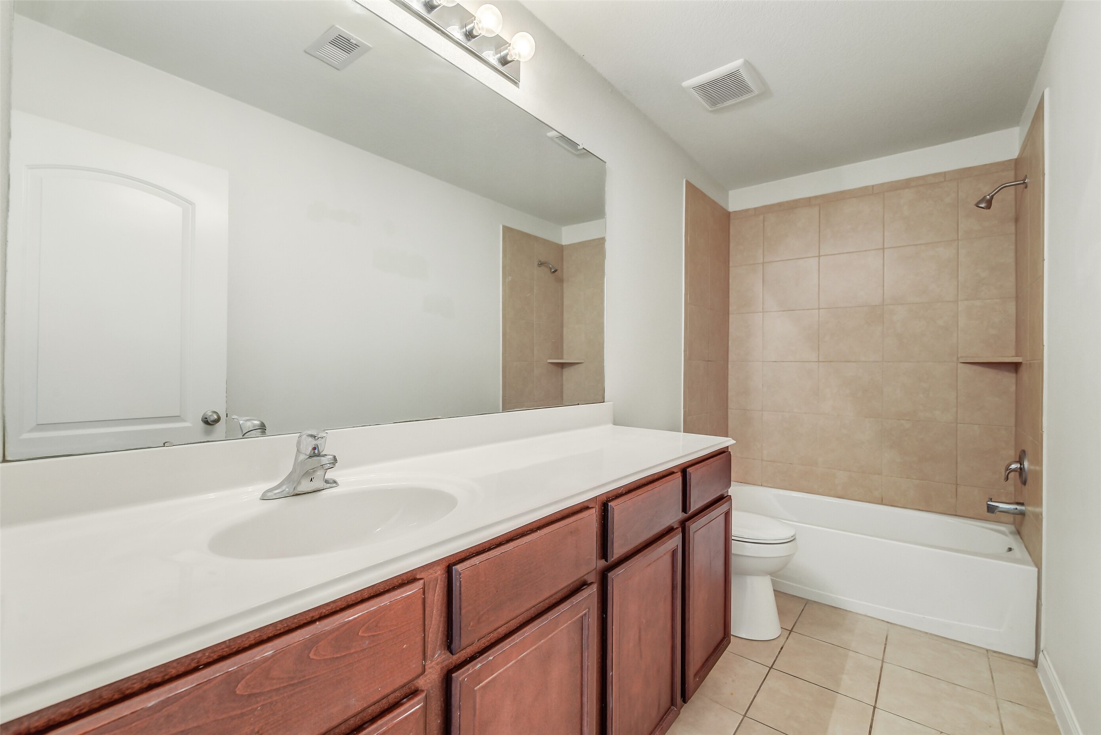22719 Tabberts Way Hockley, TX 77447 - Photo 24 of 28 a bathroom with a sink a toilet and shower
