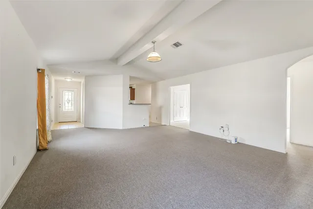 a kitchen with stainless steel appliances granite countertop a sink and a refrigerator