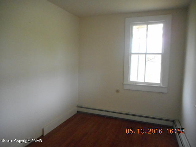 233 Perkins Pond Road Beach Lake, PA 18405 - Photo 15 of 20 an empty room with a window