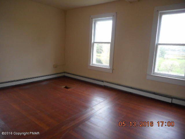 233 Perkins Pond Road Beach Lake, PA 18405 - Photo 19 of 20 an empty room with a window