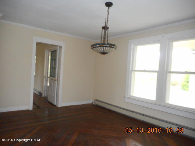 233 Perkins Pond Road Beach Lake, PA 18405 - Photo 2 of 20 a view of an empty room with wooden floor and a window